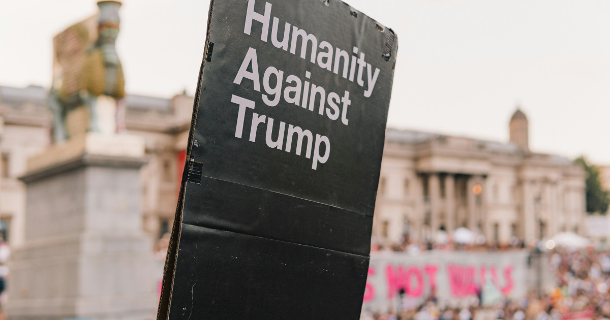 https://unsplash.com/photos/humanity-against-trump-signage-near-buildings-OV4VxONJRPw?utm_content=creditShareLink&utm_medium=referral&utm_source=unsplash